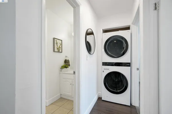 a view of a hallway with washer and dryer
