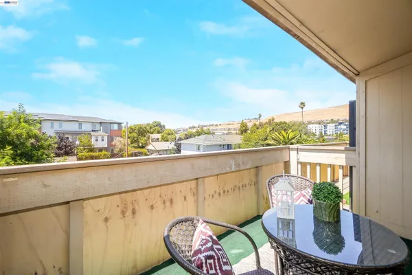 a view of a chair and table in balcony