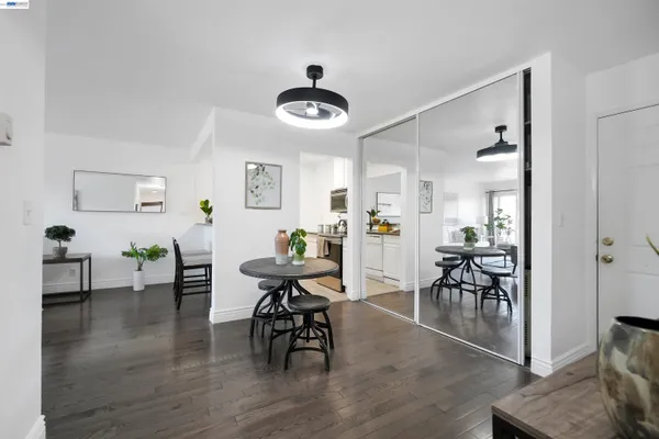 a view of a dining room with furniture and wooden floor