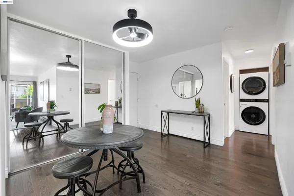 a view of a dining room with furniture and wooden floor