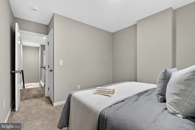 a bedroom with a bed and a mirror