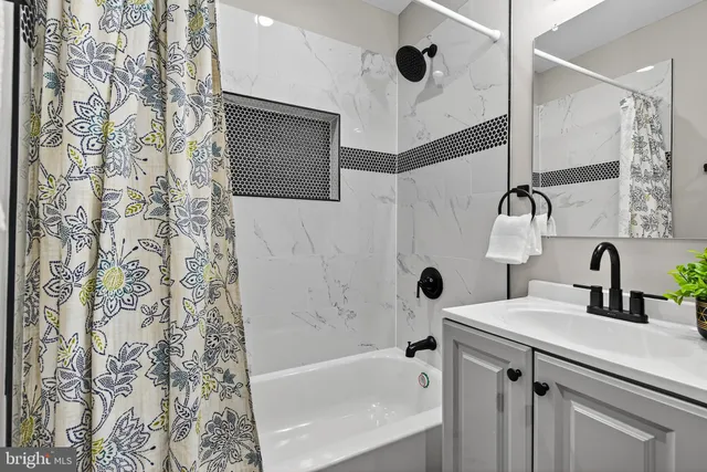 a bathroom with a sink and a shower