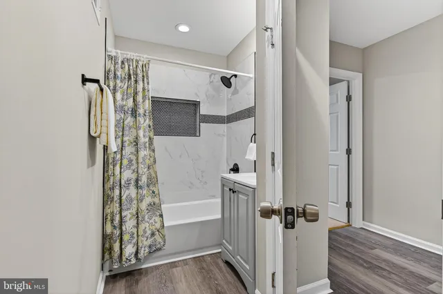 a bathroom with a shower and a tub