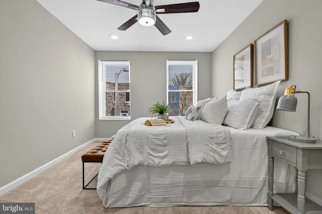 a bedroom with a bed and window