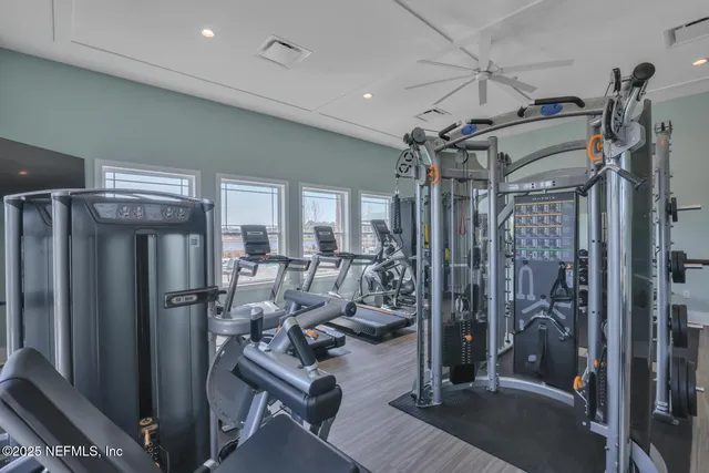 a view of a livingroom with dining room and wooden floor