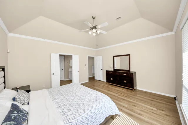 a bedroom with a bed and a dresser