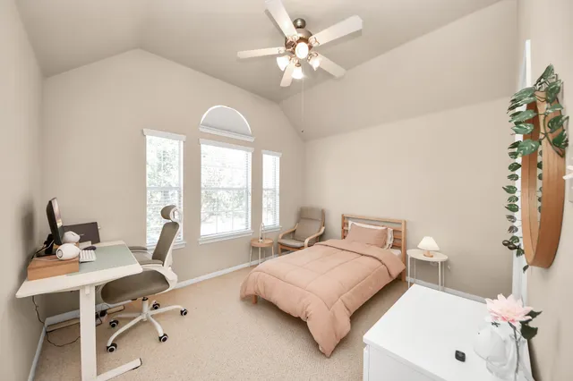 a bedroom with a bed and a table