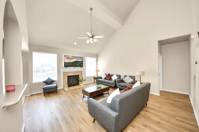 a living room with furniture fireplace and a fireplace