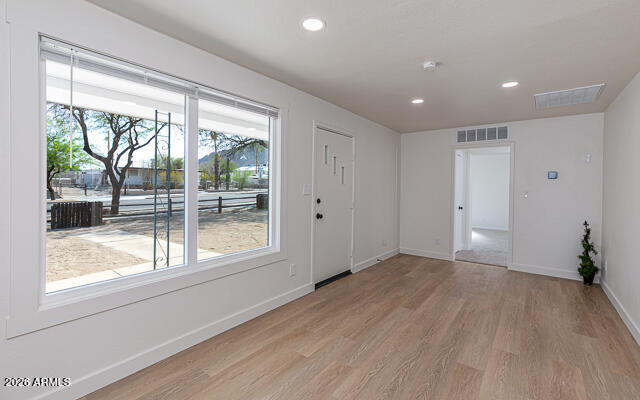 630 Solana Avenue Ajo, AZ 85321 - Photo 16 of 41 a view of empty room with wooden floor and fan