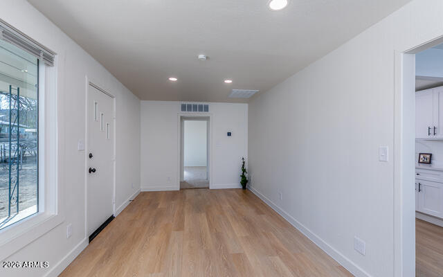 630 Solana Avenue Ajo, AZ 85321 - Photo 17 of 41 a view of a room with wooden floor and window