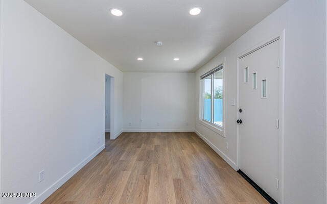 630 Solana Avenue Ajo, AZ 85321 - Photo 18 of 41 a view of a room with wooden floor and window