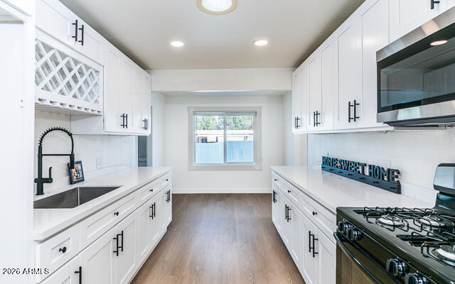 630 Solana Avenue Ajo, AZ 85321 - Photo 2 of 41 a kitchen with stainless steel appliances granite countertop a sink stove and cabinets