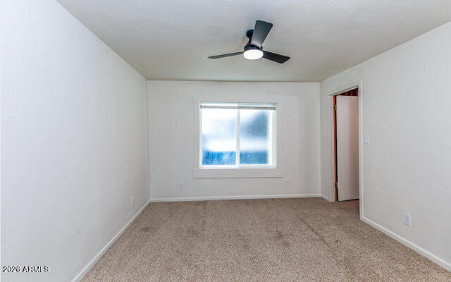 630 Solana Avenue Ajo, AZ 85321 - Photo 25 of 41 an empty room with a window