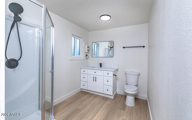 630 Solana Avenue Ajo, AZ 85321 - Photo 29 of 41 a spacious bathroom with a granite countertop toilet sink and a mirror