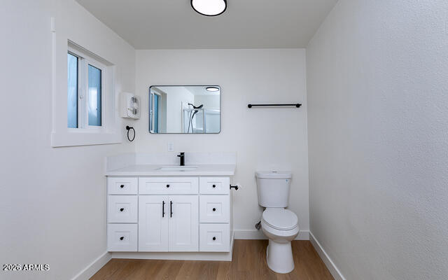 630 Solana Avenue Ajo, AZ 85321 - Photo 30 of 41 a bathroom with a toilet a sink and a mirror