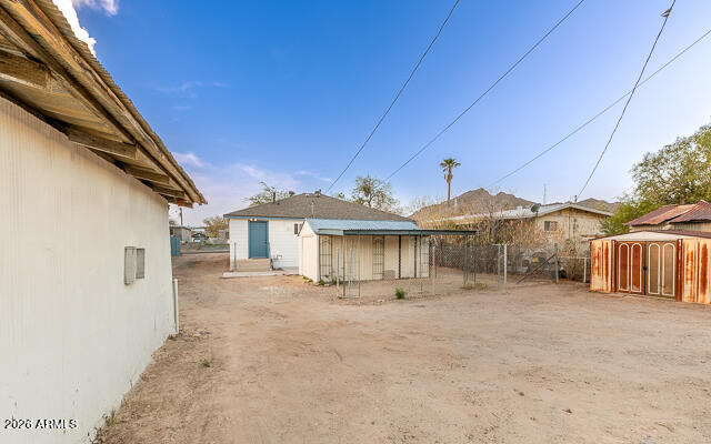 630 Solana Avenue Ajo, AZ 85321 - Photo 36 of 41 a view of a house with a backyard
