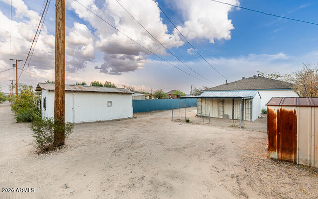 630 Solana Avenue Ajo, AZ 85321 - Photo 37 of 41 a view of a house with backyard and roof
