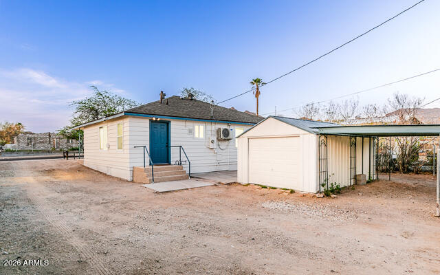 630 Solana Avenue Ajo, AZ 85321 - Photo 38 of 41 a view of a house with a yard and garage