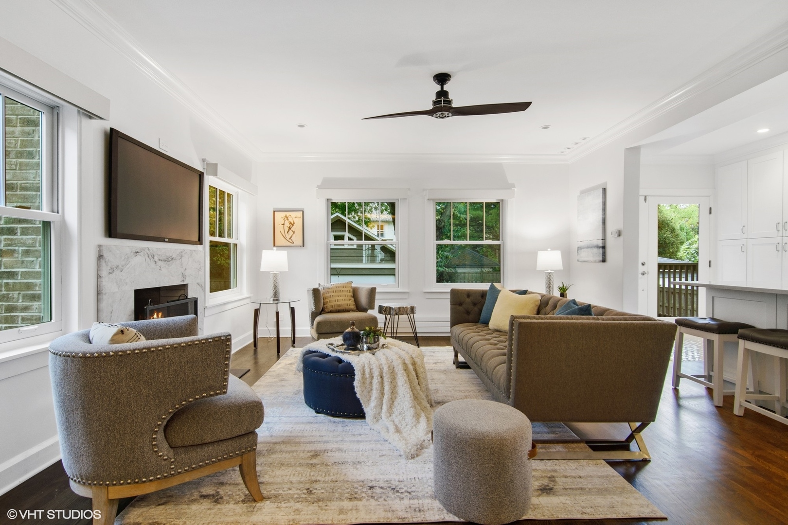 628 Abbotsford Road Kenilworth, IL 60043 - Photo 13 of 48 a living room with furniture fireplace and a flat screen tv