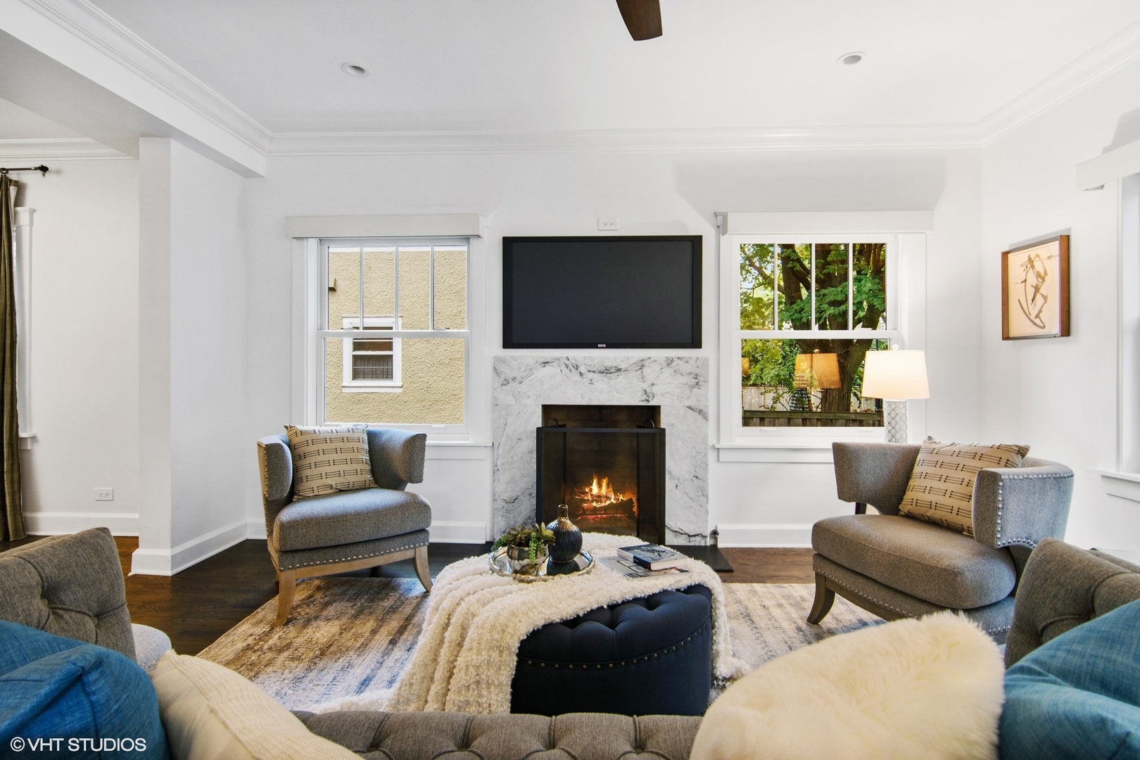 628 Abbotsford Road Kenilworth, IL 60043 - Photo 15 of 48 a living room with furniture a fireplace and a flat screen tv