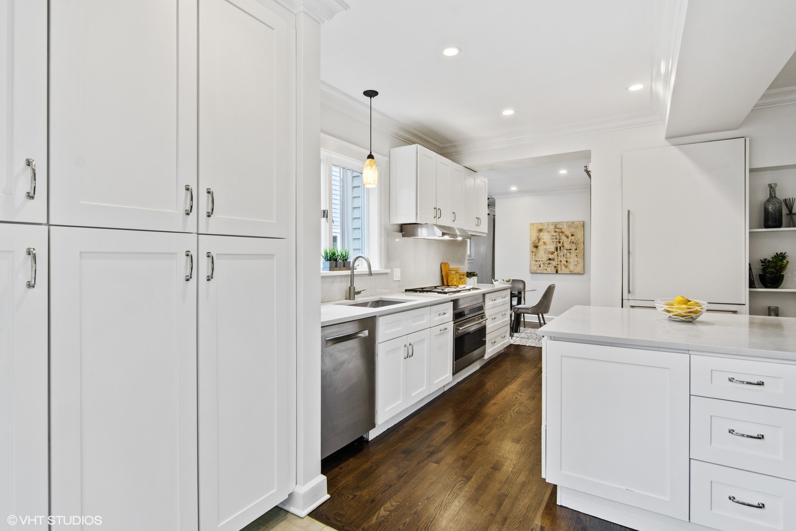 628 Abbotsford Road Kenilworth, IL 60043 - Photo 19 of 48 a kitchen with white cabinets and white appliances