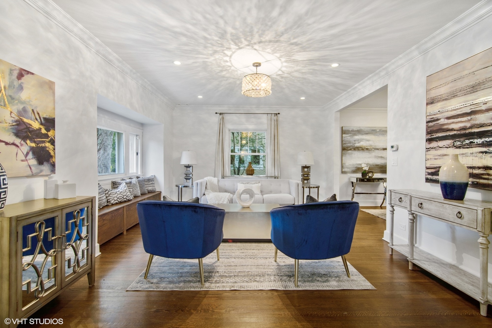628 Abbotsford Road Kenilworth, IL 60043 - Photo 6 of 48 a living room with couches and kitchen view with wooden floor