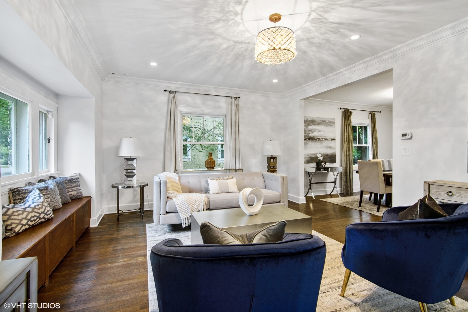 628 Abbotsford Road Kenilworth, IL 60043 - Photo 8 of 48 a living room with furniture and a chandelier