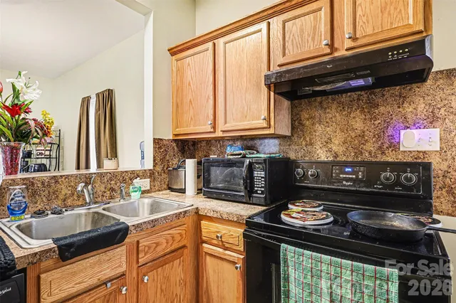 a kitchen with a stove and a sink