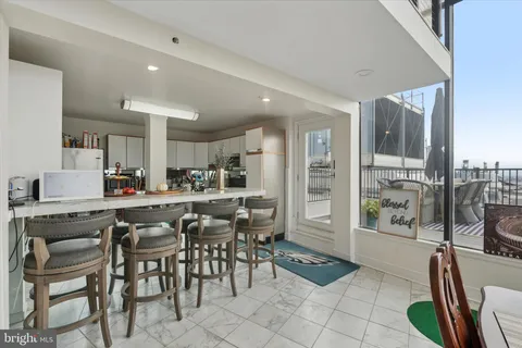 a view of a dining room kitchen and furniture