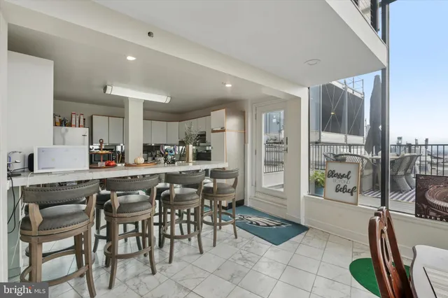 a view of a dining room kitchen and furniture