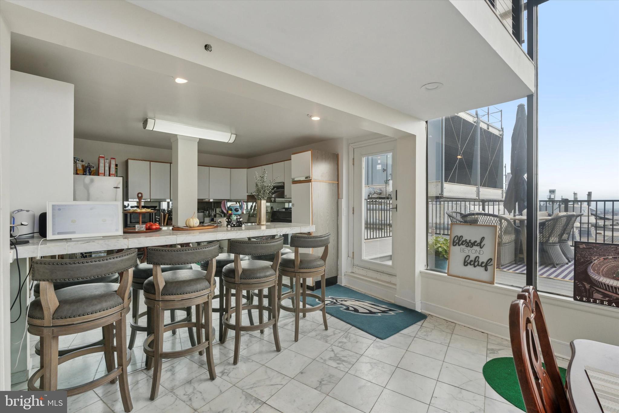 3900 West Ford Road, Unit 23B Philadelphia, PA 19131 - Photo 3 of 15 a view of a dining room kitchen and furniture