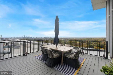 a view of a roof deck with patio