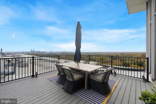 a view of a roof deck with patio