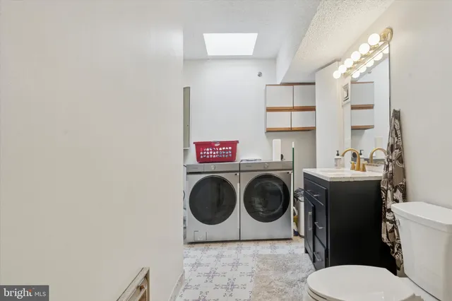 a bathroom with a toilet and a sink