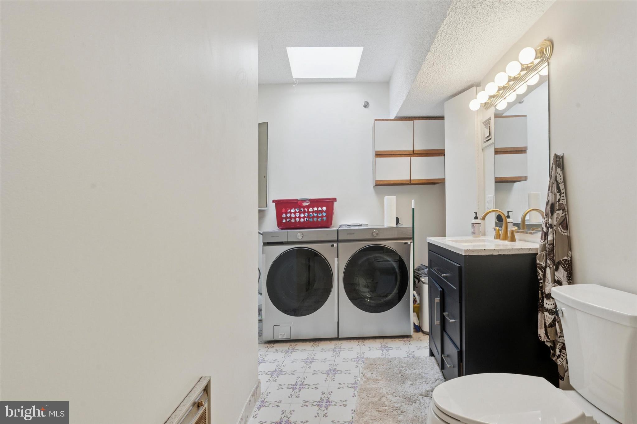 3900 West Ford Road, Unit 23B Philadelphia, PA 19131 - Photo 8 of 15 a bathroom with a toilet and a sink