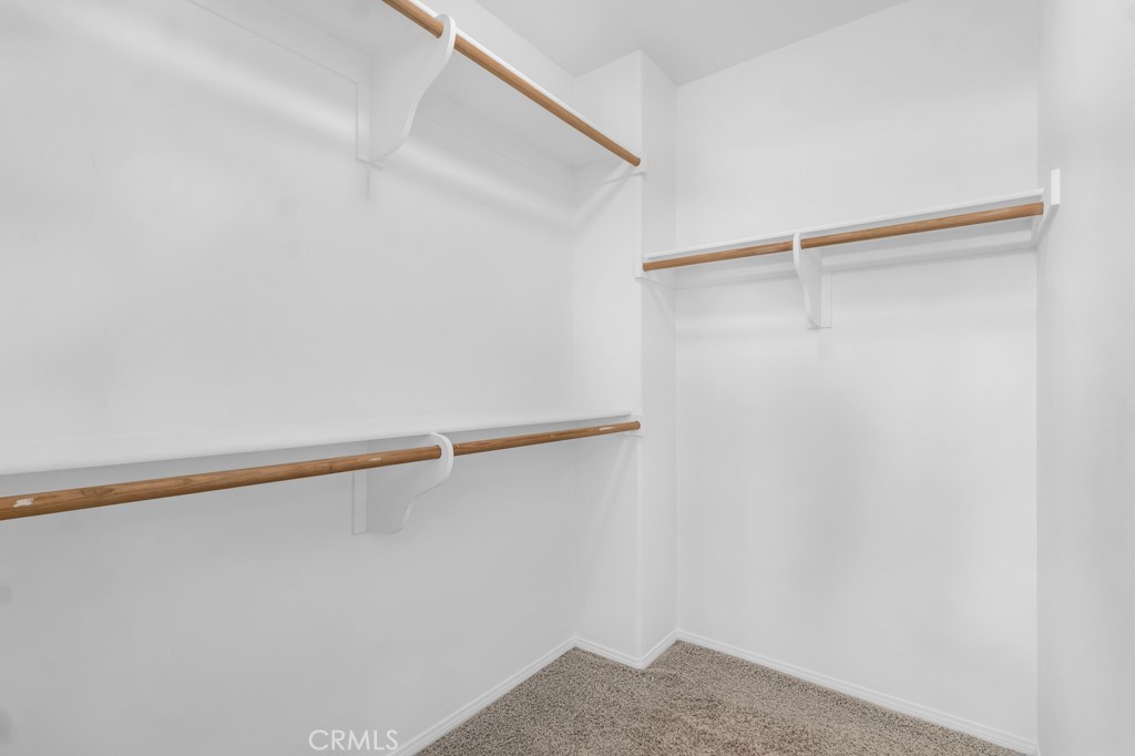 20317 Livorno Porter Ranch Porter Ranch, CA 91326 - Photo 20 of 33 a view of small space with racks on the wall
