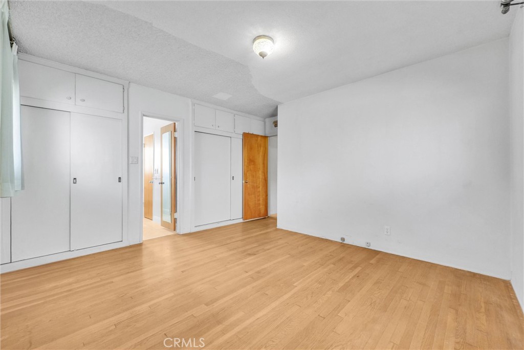 2680 Chatwin Avenue Long Beach, CA 90815 - Photo 15 of 33 a view of an empty room with wooden floor