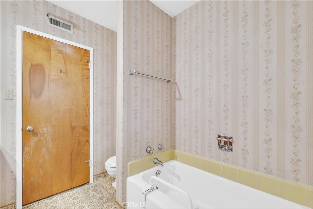 2680 Chatwin Avenue Long Beach, CA 90815 - Photo 20 of 33 a bathroom with a bathtub and shower