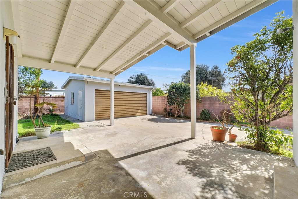 2680 Chatwin Avenue Long Beach, CA 90815 - Photo 24 of 33 a front view of a house with a yard and garage