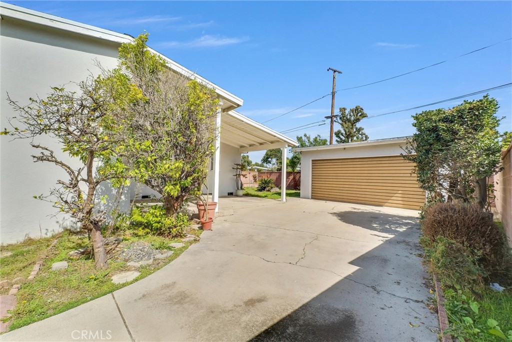 2680 Chatwin Avenue Long Beach, CA 90815 - Photo 25 of 33 a view of a house with a yard and potted plants