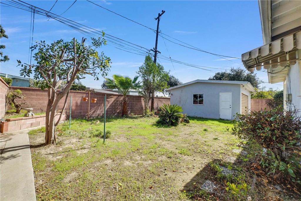 2680 Chatwin Avenue Long Beach, CA 90815 - Photo 29 of 33 a backyard of a house with plants and large tree