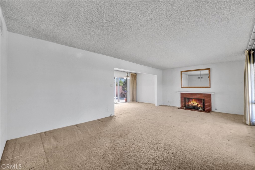 2680 Chatwin Avenue Long Beach, CA 90815 - Photo 4 of 33 a view of an empty room with a fireplace