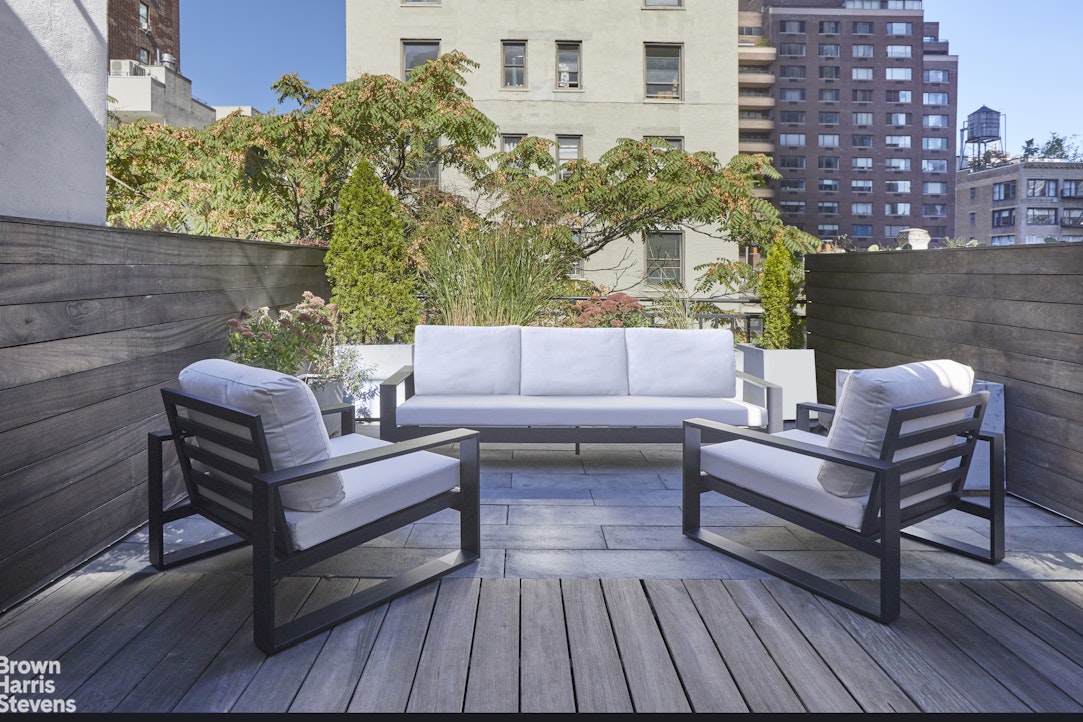 219 West 70th Street Manhattan, NY 10023 - Photo 18 of 20 a view of a roof deck with couches and potted plants