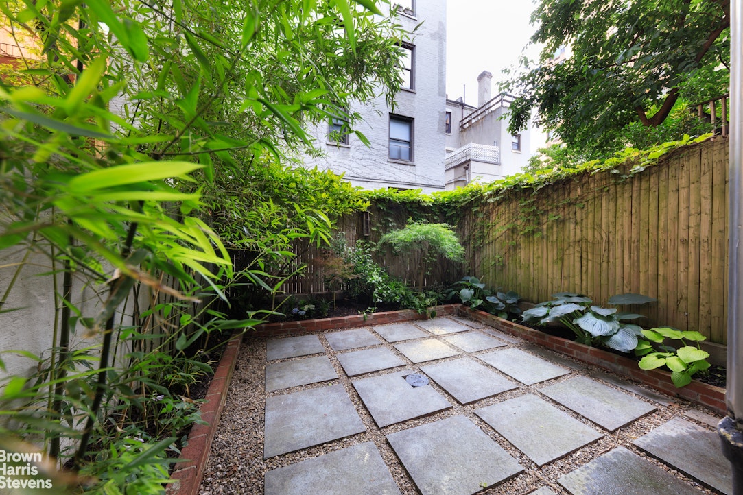 219 West 70th Street Manhattan, NY 10023 - Photo 5 of 20 a view of a pathway with a flower