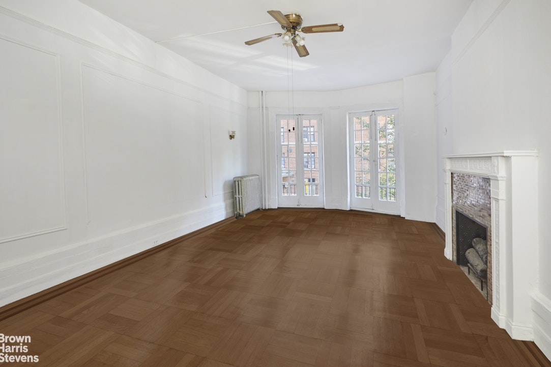 219 West 70th Street Manhattan, NY 10023 - Photo 6 of 20 a view of empty room with window