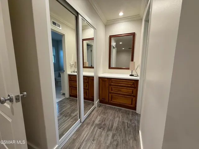 a bathroom with a granite countertop sink mirror and toilet