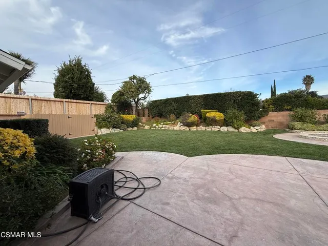 a view of a lake with a yard