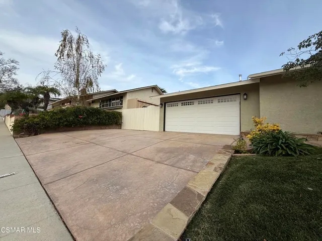 a house view with a backyard space