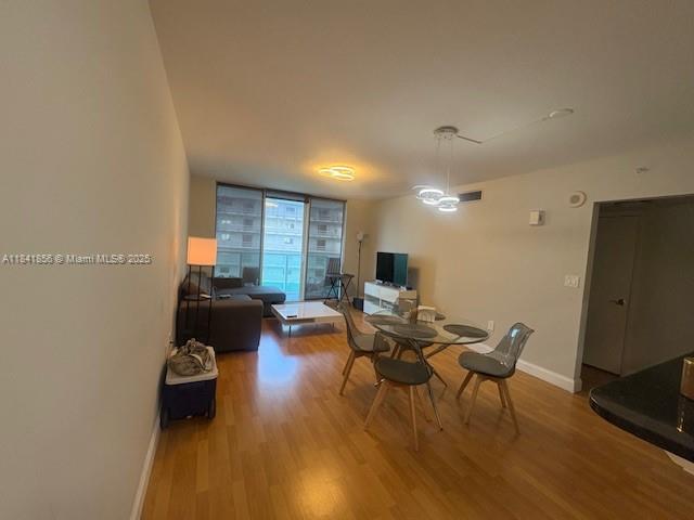 Brickell on the River Miami, FL 33131 - Photo 3 of 12 a living room with furniture and a wooden floor