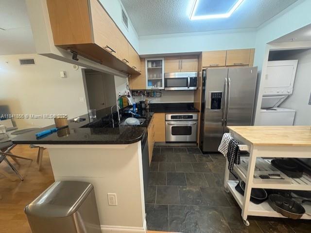 Brickell on the River Miami, FL 33131 - Photo 4 of 12 a kitchen with stainless steel appliances a stove a sink and a refrigerator